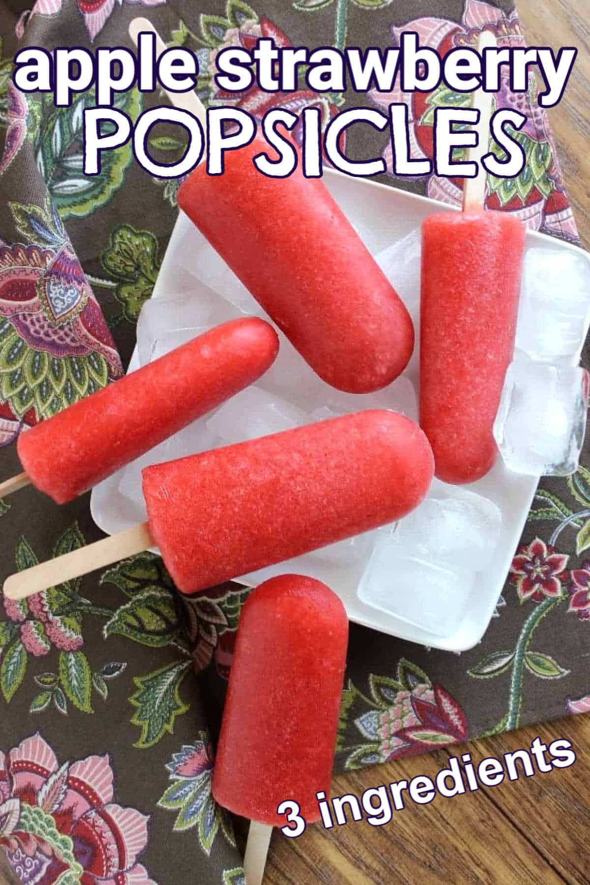 Overhead photo of 5 red popsicles laying every which way on a bed of ice and a square white plate with text for Pinterest.