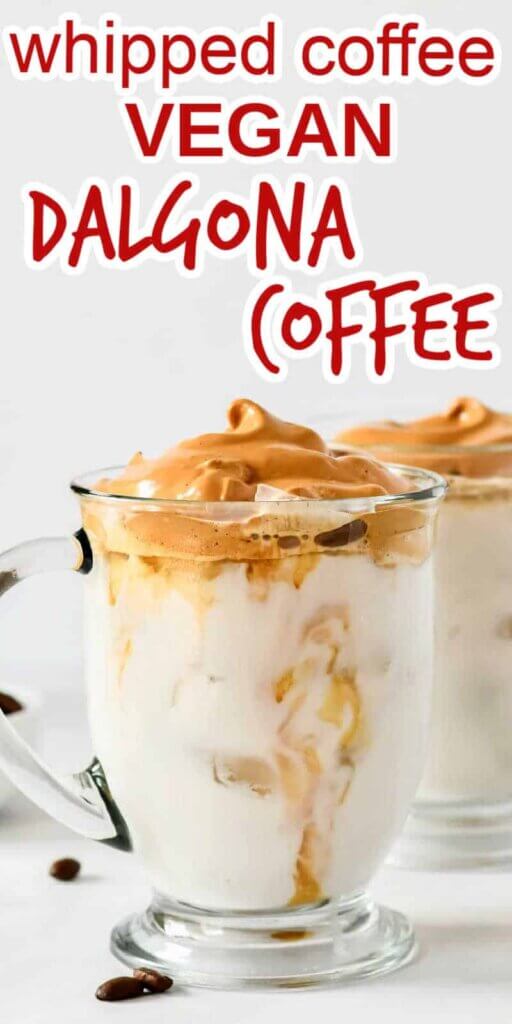 Whipped coffee on top of a mug of iced dairy free milk with text on the top for pinning.