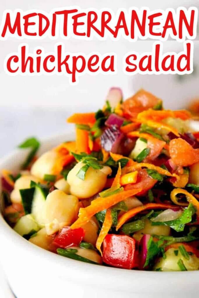 Closeup photo of vegan chickpea salad with fresh veggies and text at the top in red for pinning.