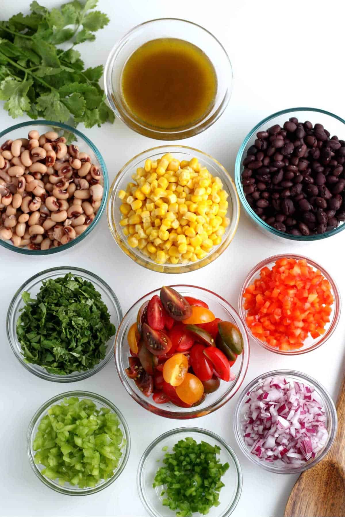 Overhead view of each ingredient pared and diced and in their own small bowl.