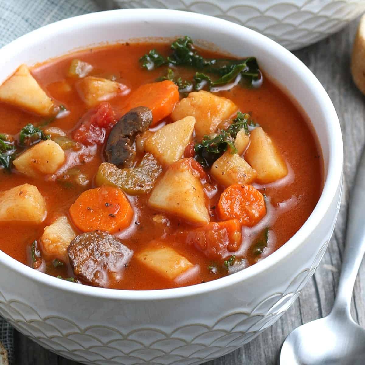 Close up of an instant pot vegetable soup with potatoes, carrots and mushrooms.