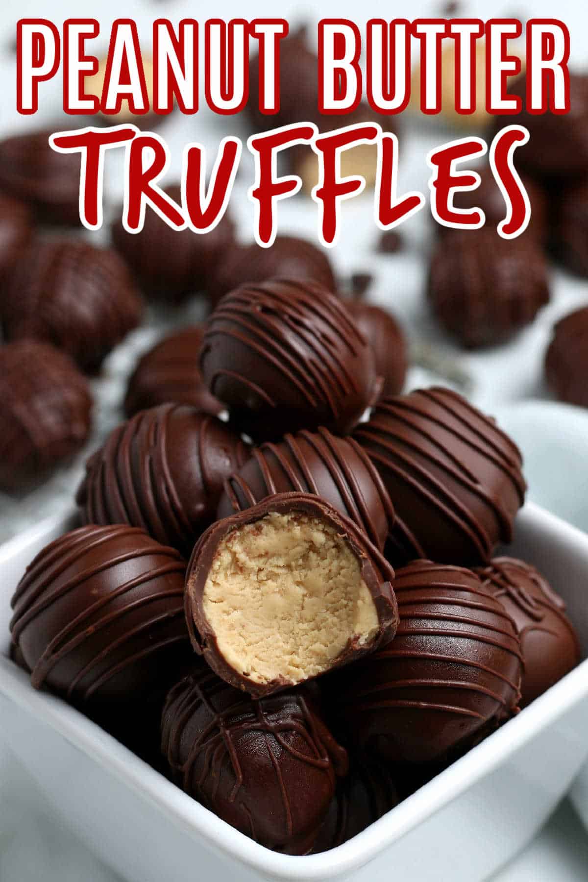 Close up photo of peanut butter truffles with a bite out of the front one.