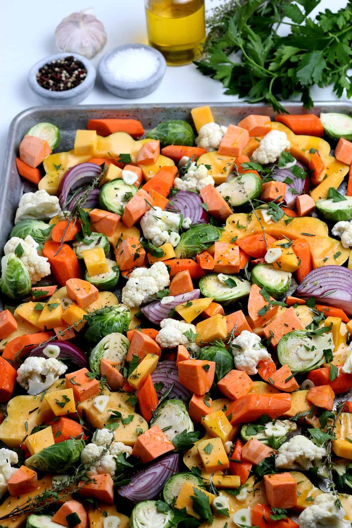 Vegetables after being roasted and still on the baking sheet.