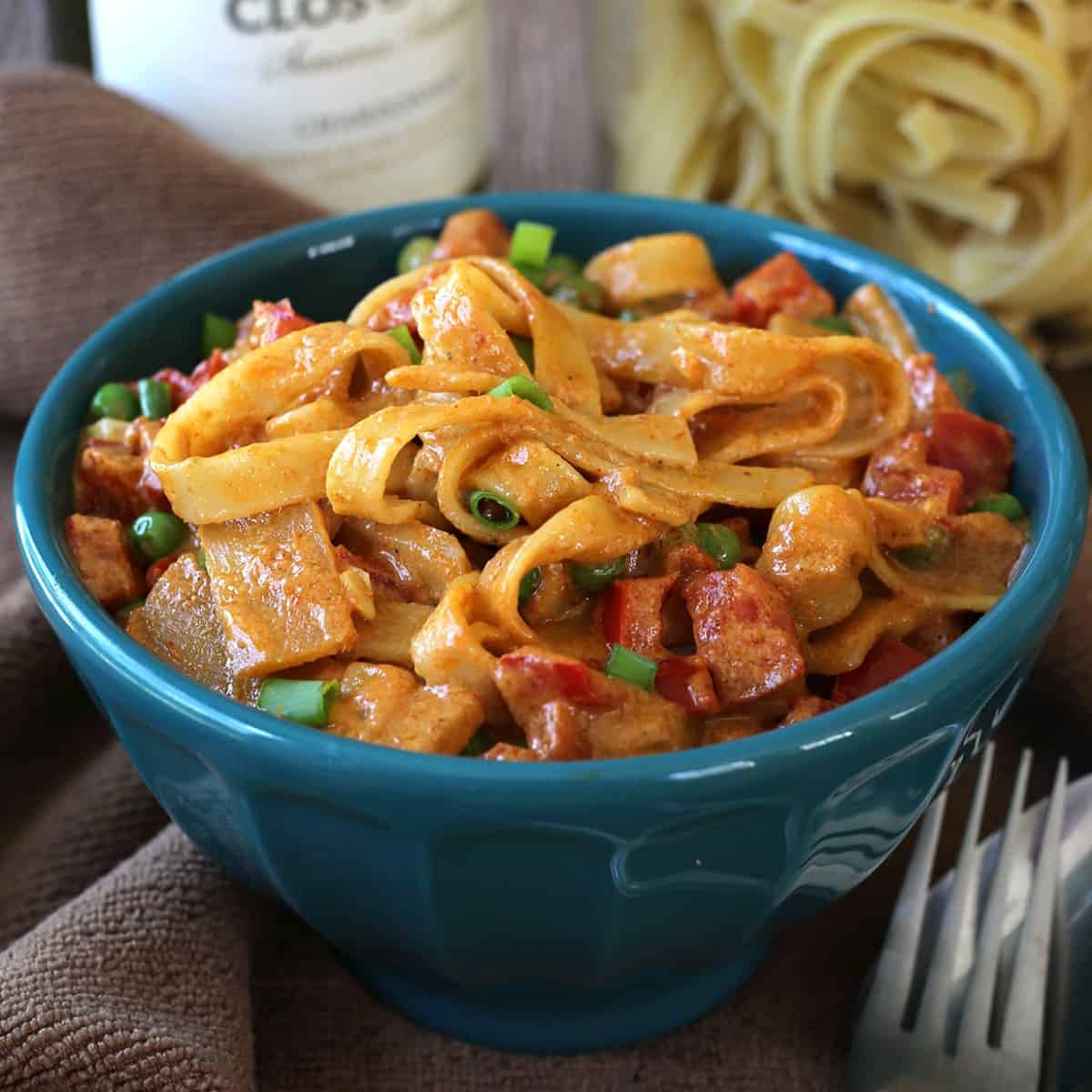 Creamy sauced Thai Curry Recipe in a turquoise bowl.