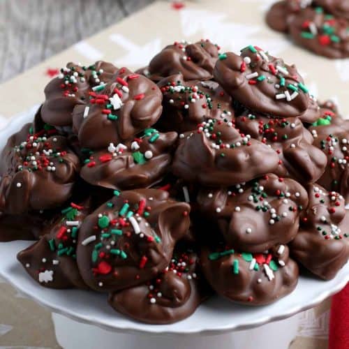 Pile of chocolate and peanut candy with Christmas sprinkles.