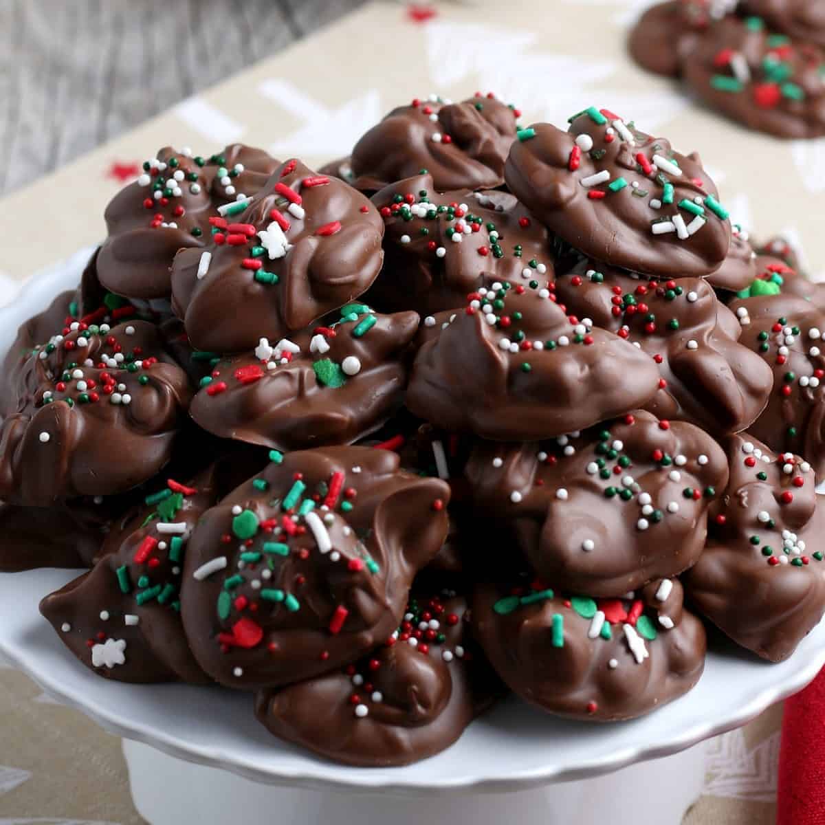 Pile of chocolate crock pot candy with Christmas sprinkles.