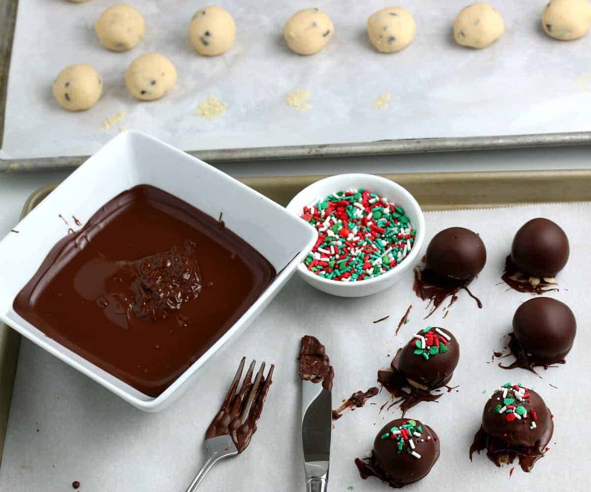 Photo showing decorating the chocolate balls with sprinkles.