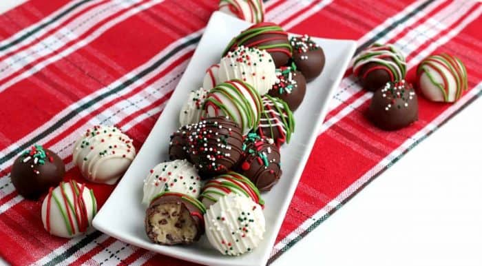 Wide photos showing chocolate covered candy decorated in red, white and green.