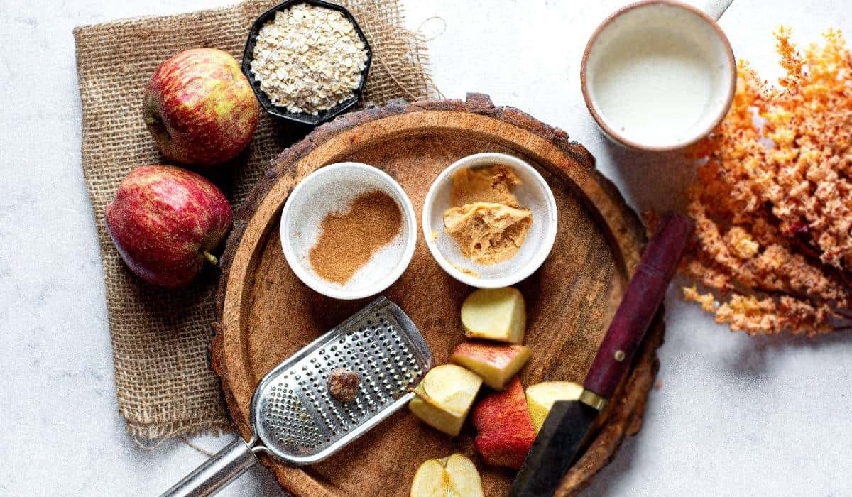 Six ingredients for a peanut butter apple smoothie.