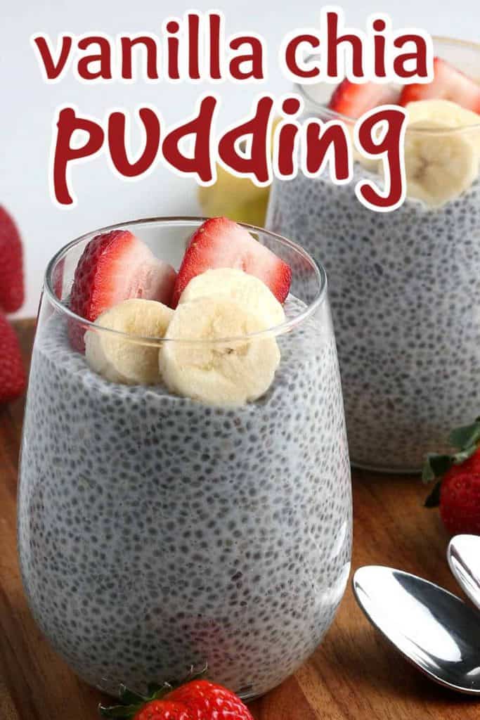 Clear glass tumblers filled with vanilla chia seed pudding with strawberries on the side.