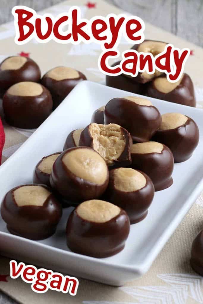 Tilted white rectangle plate full of buckeye candy with a bite out of one.