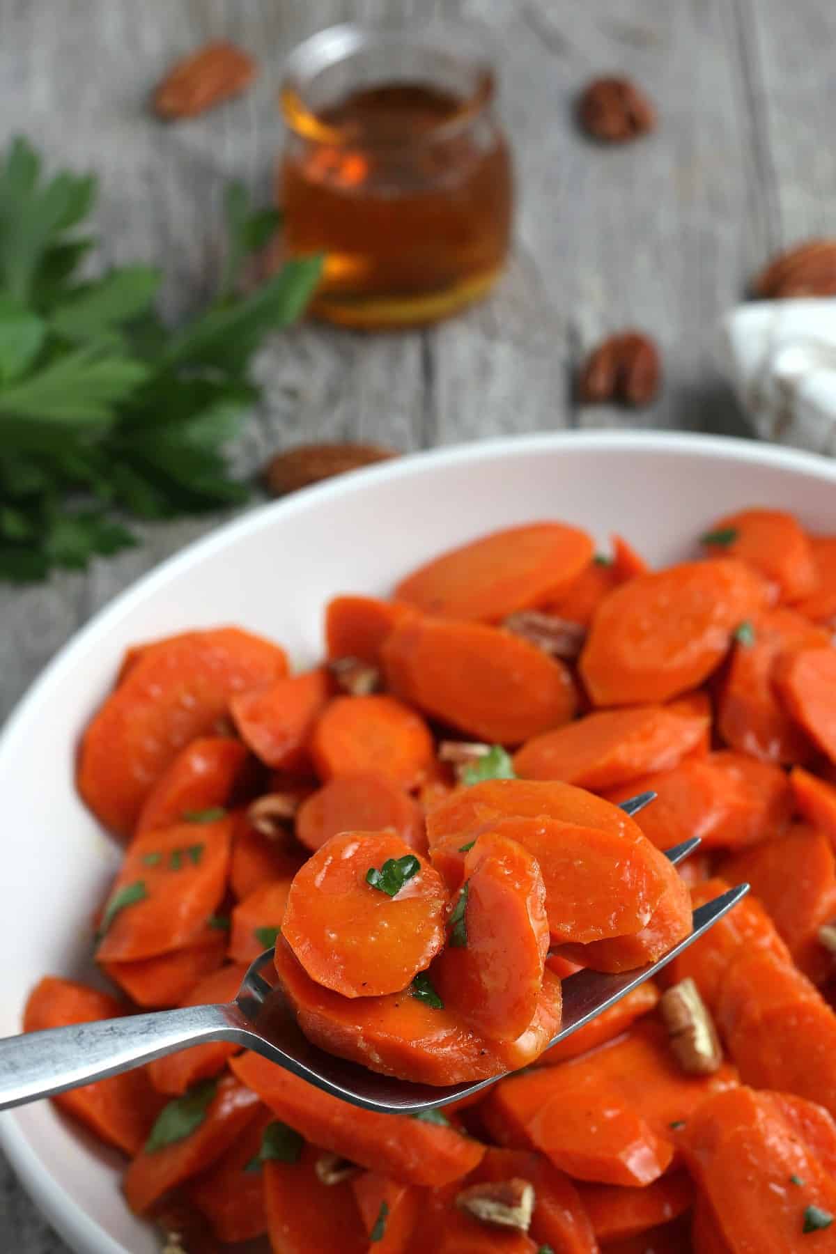 Close up photo of a tasty side dish on a fork.