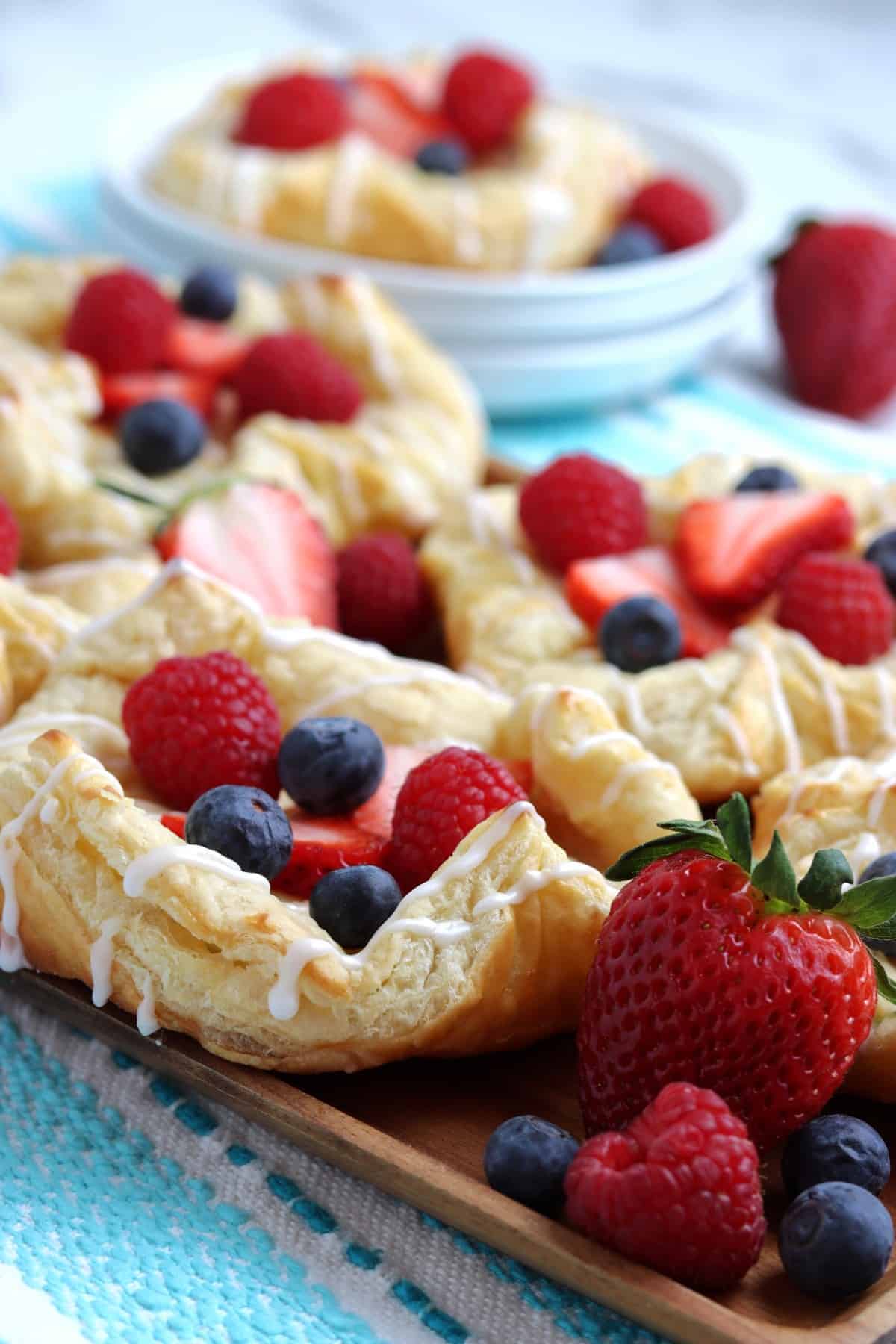 Slanted closeup of a serving board filled with brunch treats.