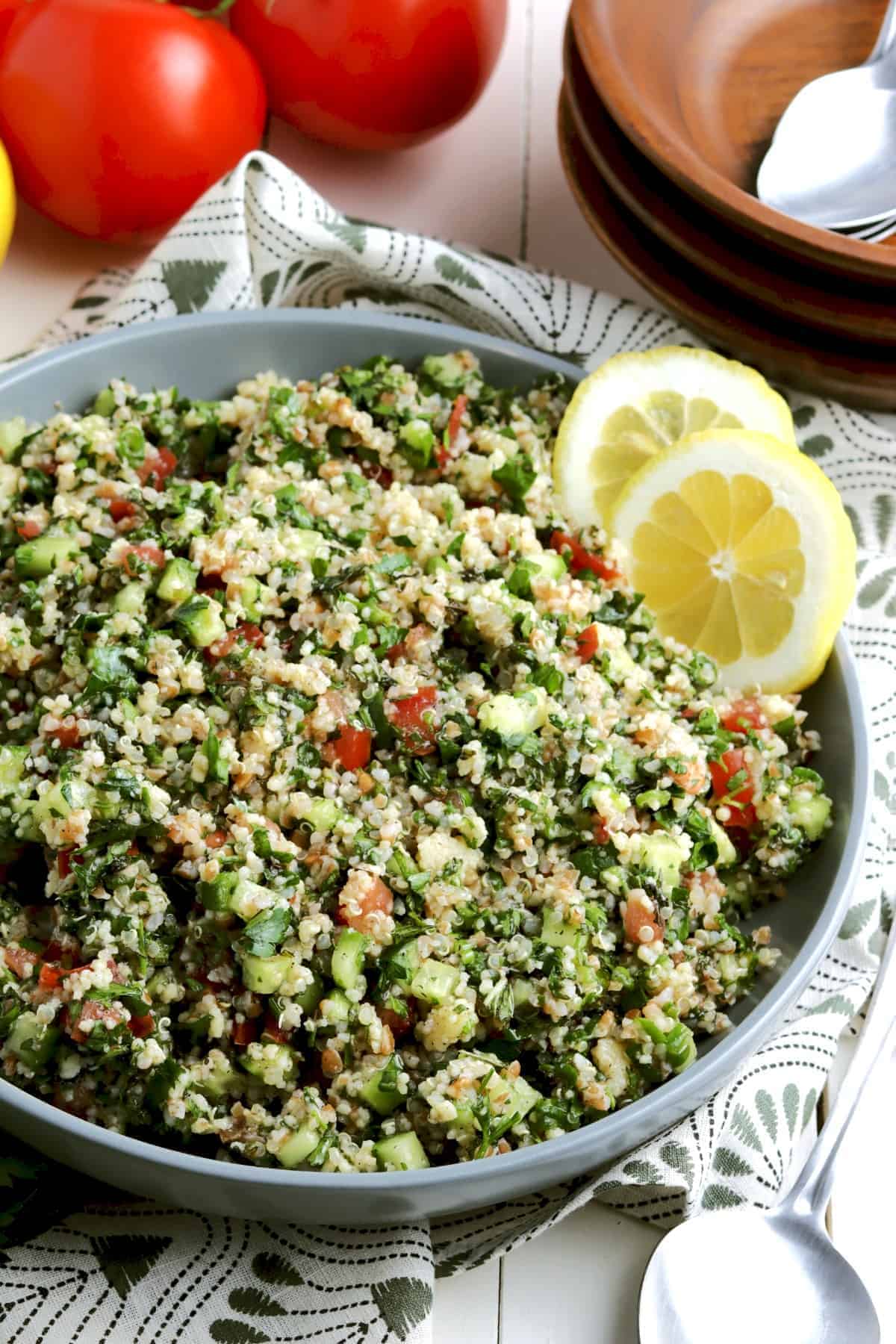 Huge tilted bowl filled with fresh tabouli salad