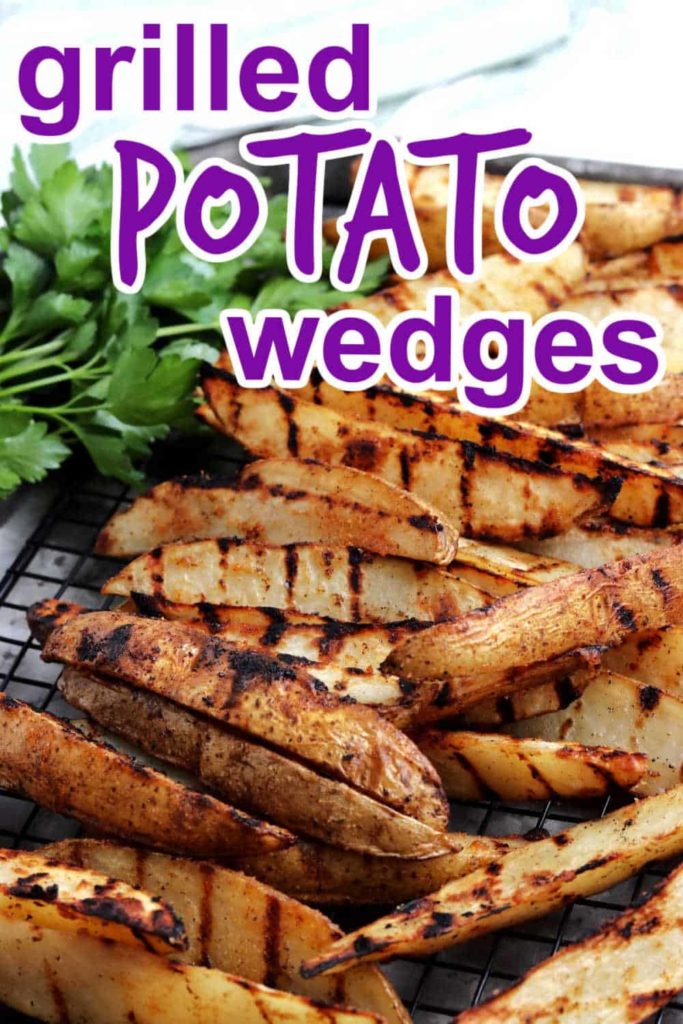 Grilled potato wedges stacked high with text above for pinterest.