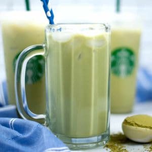 Tall glass mug filled with iced green tea latte,