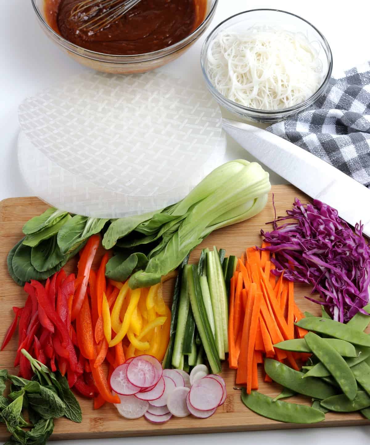 Sliced, diced and cut variety of vegetables for Vietnamese summer rolls.