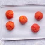 Place peeled tomatoes on baking sheet