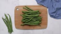 Snap the tips off of the green beans
