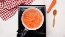 Place the prepared carrots in the boiling water