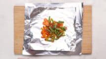 Spread the vegetables in a longer flat rectangle on the foil