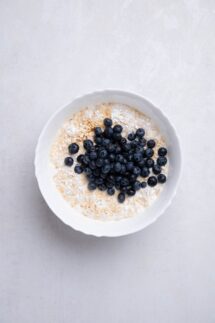 Add the rolled oats baking powder soy milk maple syrup vanilla extract and blueberries