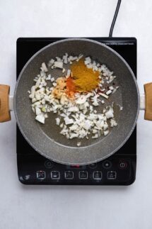 Add the chopped onion garlic salt cayenne pepper paprika ginger and curry powder