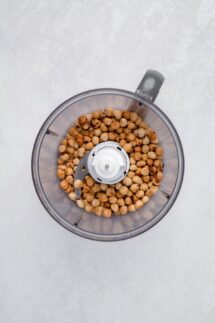 Hand pick out the cleanest hazelnuts and toss them in a food processor