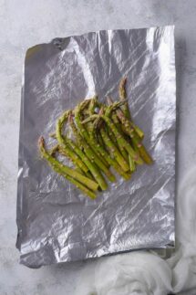 Add asparagus to foil sheets that are large enough to fold over the asparagus and crimp all of the edges