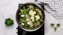 Stir in the cooked rice broccoli cheese salt and pepper