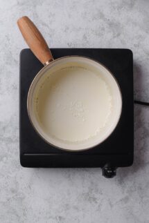 Whisk non-dairy milk and cornstarch in a saucepot
