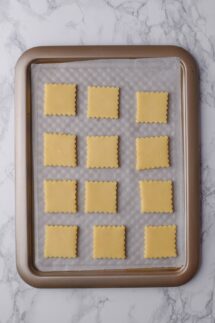Arrange the cookies on two baking sheets lined with parchment paper