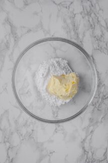 Beat powdered cane sugar with Vegan butter until fluffy in a large bowl