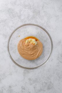 In a large bowl beat peanut butter butter and vanilla extract until creamy