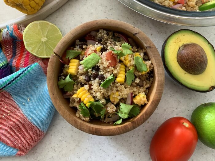 Mexican quinoa salad in a wooden bowl ready to serve