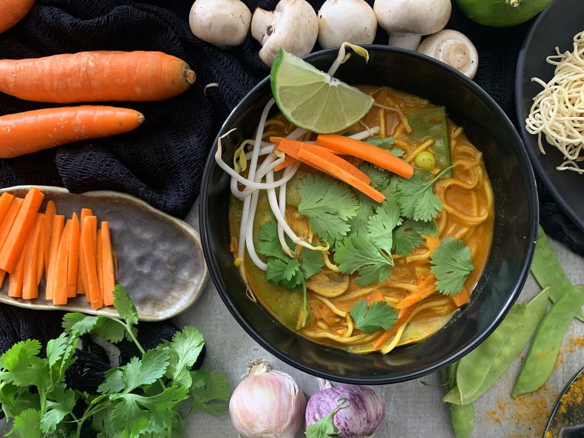 vegan ramen in a serving bowl, garnished and ready to eat